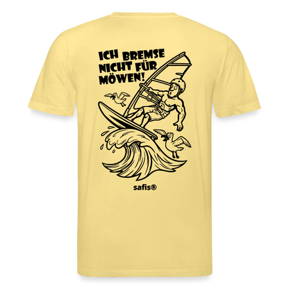 Schwarzer Backprint auf einem hellgelben safis® T-Shirt aus Bio-Baumwolle mit der Aufschrift 'ICH BREMSE NICHT FÜR MÖWEN!'. Die Cartoon-Grafik zeigt einen Windsurfer mit Helm auf einer Welle, umringt von fliegenden Möwen. Nachhaltige Windsurf-Kleidung.-Möwe- Unisex Bio-T-Shirt CREATOR Backprint - Gelb Viva 